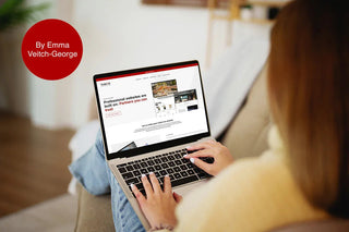 Woman browsing a professional web design agency homepage on a laptop at home